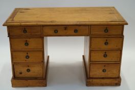 A pine twin pedestal desk