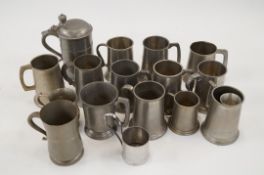 A large collection of pewter mugs etc
