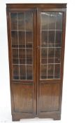 A 20th century oak glazed bookcase