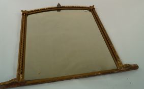 A large gilded decorative mantel mirror