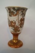 An early 20th century oriental cup, decorated with typical scenes