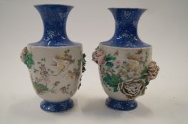 A pair of oriental decorative vases