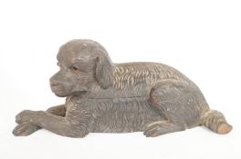 A Black Forest carved snuff box in the form of a dog