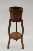 Three legged occasional table and brass bound wood ice bucket