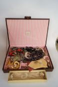 A collection of costume jewellery, in a case