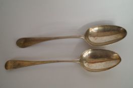 A Georgian silver bottom marked tablespoon, circa 1763, and another later example with duty mark,