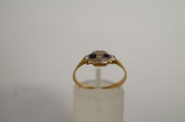 A synthetic sapphire and diamond ring, finger size M 1/2