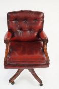A 20th century leather swivel chair