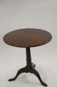 An 18th century and later oak tilt top table