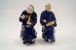 A pair of oriental seated figures