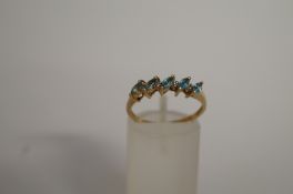 A five stone blue topaz dress ring, finger size P