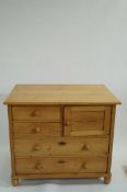 A pine kitchen chest of drawers
