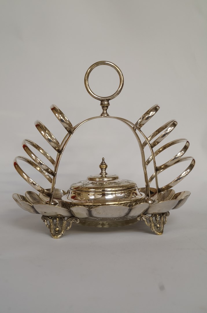 A late Victorian silver plated combination toast rack and covered butter dish, the arched rack