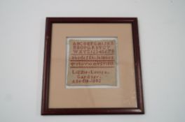 A late 19th century sampler dated 1882, Lizzie Louise Gardner