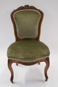 A late 19th century walnut carved chair