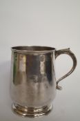 A George II silver mug, by J.K. Manners, London 1735, of plain gently bellied form above a tuck in