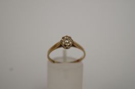 A diamond single stone ring, illusion set in 9ct gold; finger size P
