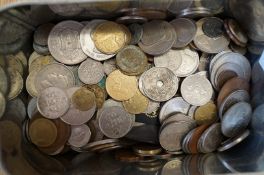 A tin of foreign and European coins