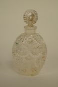 A pressed moulded glass perfume bottle & stopper, the base stamped "R. Lalique, France 1/2 FL OZ"