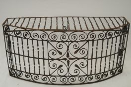 A large 20th century bow front cast iron fire grate