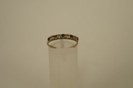 A sapphire and single cut diamond set 9ct gold eternity ring, finger size M, 1g gross