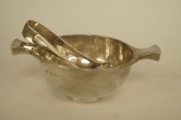 A silver quaich type bowl, by Nathan and Haynes, Chester 1898, 12.5cm across; with a pair of