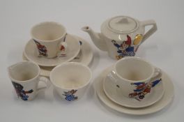 A children's tea set for two decorated with Noddy, Gollywog and Peter Rabbit