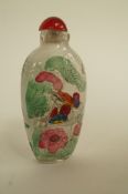 An oriental snuff bottle decorated with swans