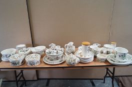 A large collection of Portmerion botanic garden items including vegetable dishes, coffee pot, mugs