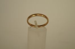 A 9ct gold wedding ring of D section, 2.9mm wide, finger size Q 1/2, 2.4g gross
