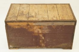 An early 20th century pine travelling trunk