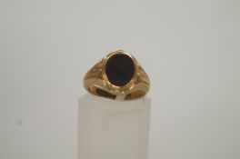 A bloodstone 9ct gold signet ring, finger size G, 4 grams gross, cased