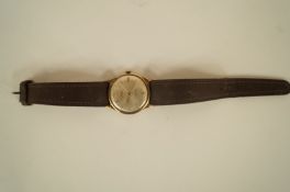 Lanco, a gentleman's 9ct gold wristwatch, Birmingham 1963, the white dial with gilt batons, 12, 6,