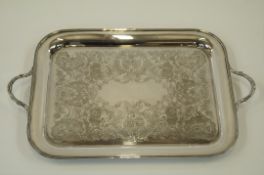 A two handled rectangular electroplated tray, with engraved and chased rococo style decoration,