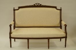 A late 19th century carved French settee in Louis XVI style