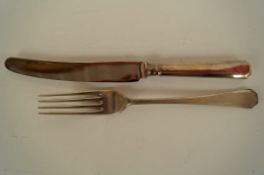 A silver dinner fork and silver handled dinner knife, retailed by Harrods, maker G & H Sheffield