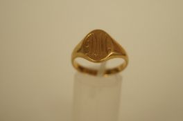 A gentleman's 18ct gold signet ring, the oval head monogrammed, finger size S 1/2, 7.5 grams gross