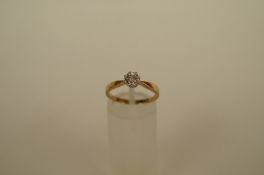 A single stone white stone ring, stamped '18ct and 'PLAT', six claw setting