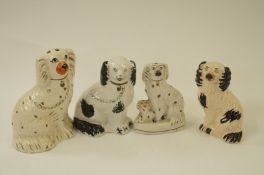Four Staffordshire dogs