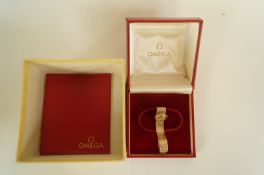 Omega, a ladies 9ct gold bracelet watch, the circular white signed dial with gilt and gilt black