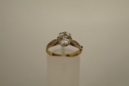 A single stone cubic zirconia 9ct gold ring, with stone set shoulders finger size N 1/2, 2.3 grams