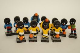 A collection of 12 golly footballers