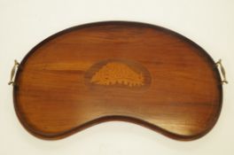 19th century kidney shaped serving tray with shell central motif and brass handles