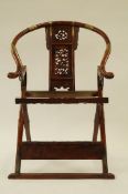 A 19th century Chinese War Lord Hunting chair, carved in huanghuali rosewood. Folds with foot rest.