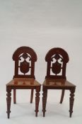 A pair of early 20th century hall chairs