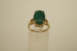 A single stone malachite 9ct gold ring, finger size N, 4.9g gross