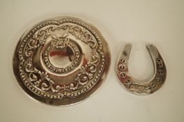 A circular silver pocket or purse mirror; with a silver filled horse shoe charm