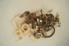 A collection of silver, silver coloured and metal and metal jewellery, with a broken row of non-