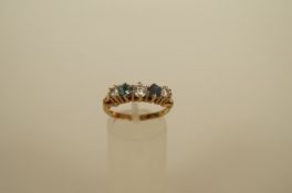 A five stone cubix zirconia dress ring, set with colourless and blue stone, 2.7g gross
