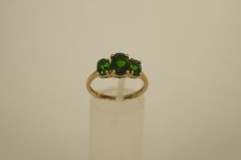 A three stone green tourmaline 9ct gold dress ring, set with graduated oval cuts, finger size P, 2.
